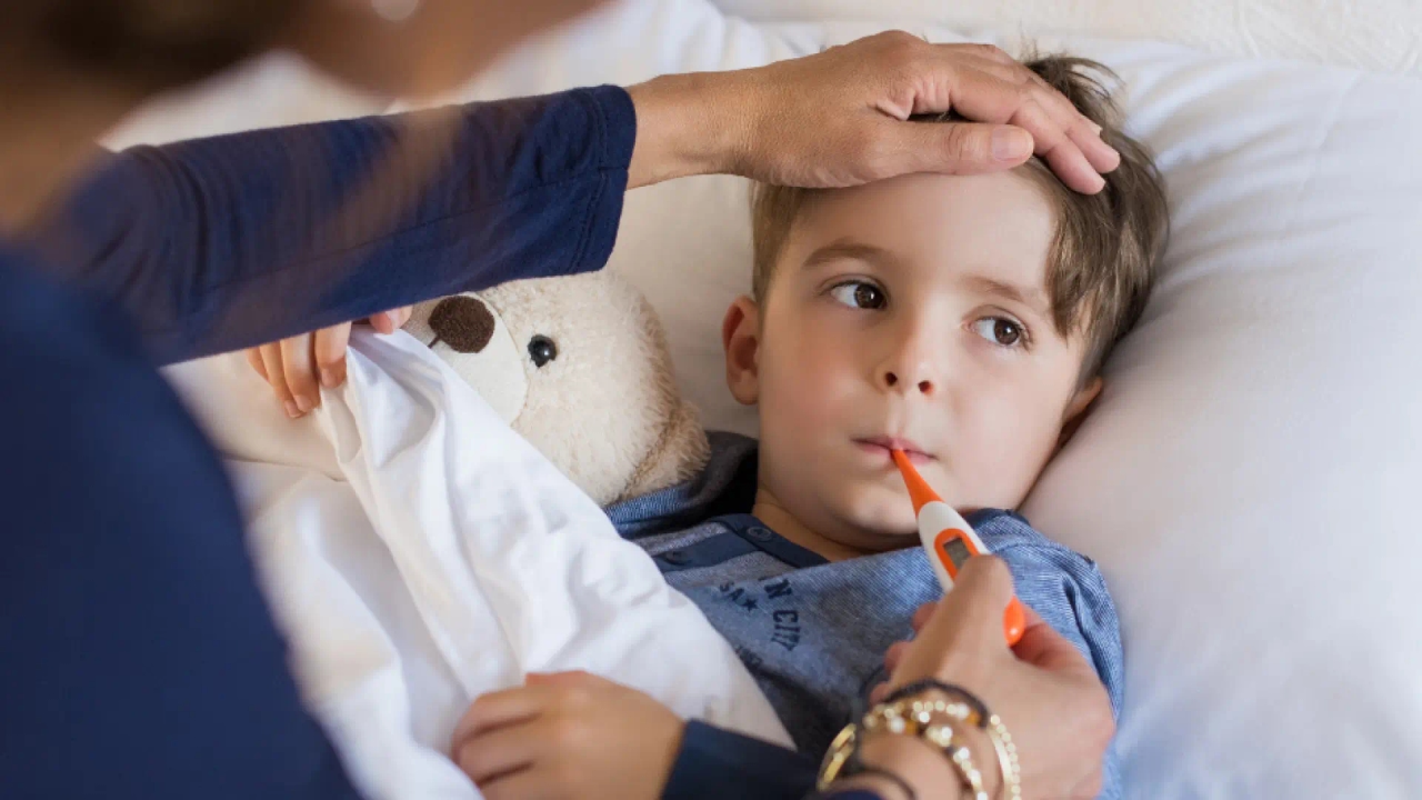 What should I do if I get a call from the nursery school because my child has a fever?